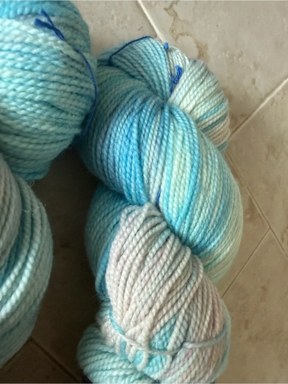 Madelinetosh Hand-Dyed Yarn Skeins in Aqua and Pale Blue